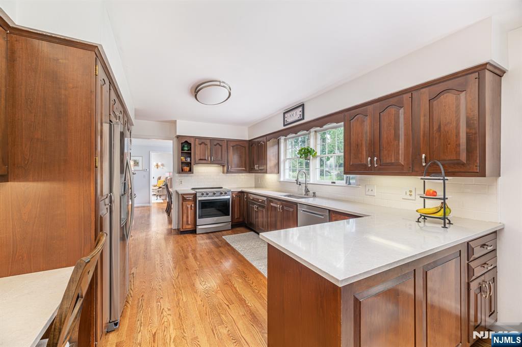 208 Willows Road Newton, NJ 07860 - Photo 21 of 44 a kitchen with a sink a counter top space and stainless steel appliances