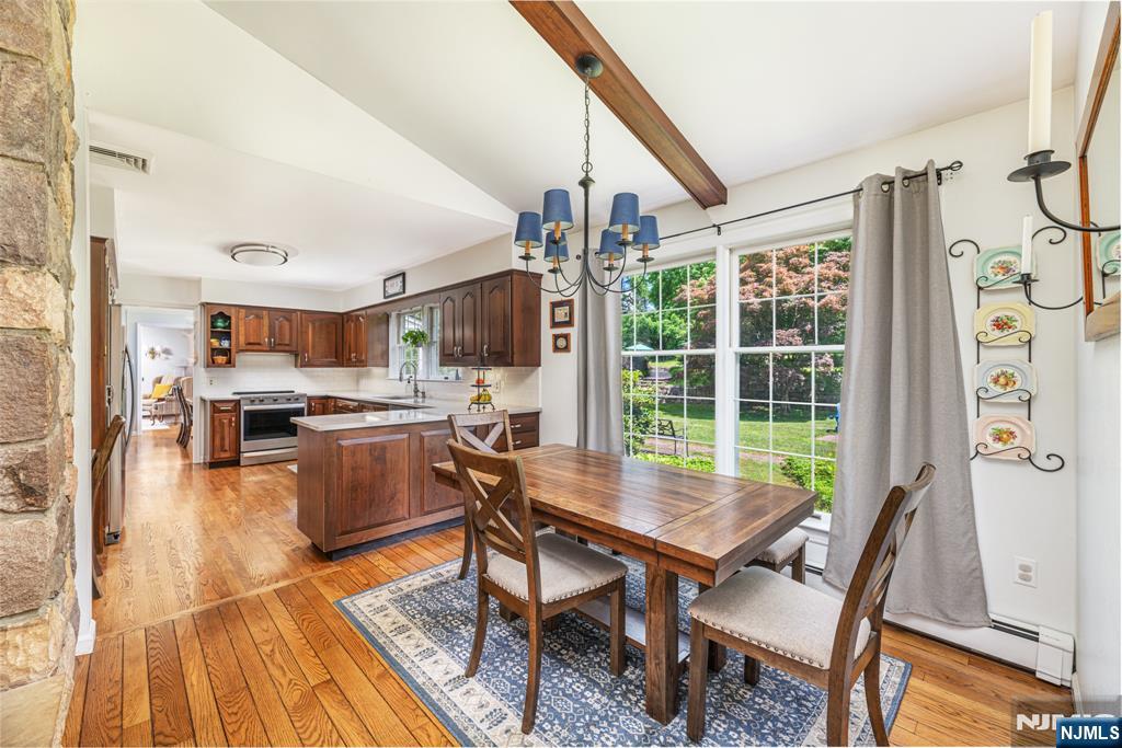 208 Willows Road Newton, NJ 07860 - Photo 23 of 44 a dining room with furniture and wooden floor