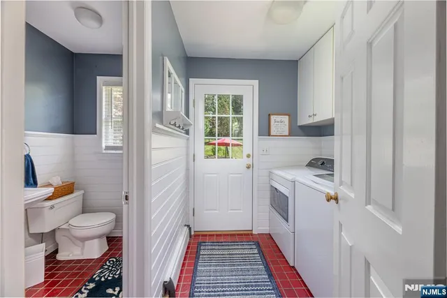 a kitchen with a refrigerator and a sink