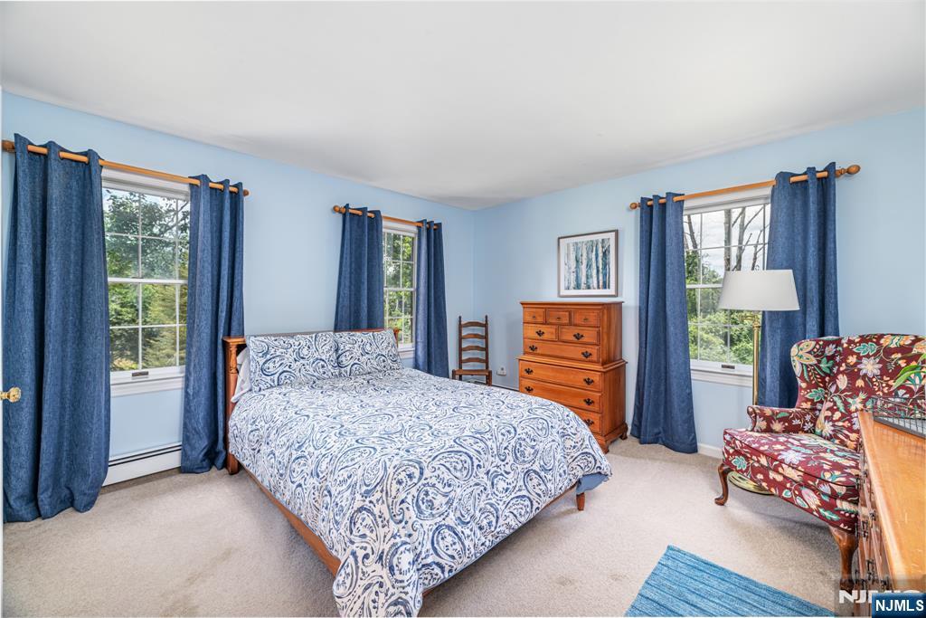 208 Willows Road Newton, NJ 07860 - Photo 33 of 44 a bedroom with a bed and a dresser next to a window