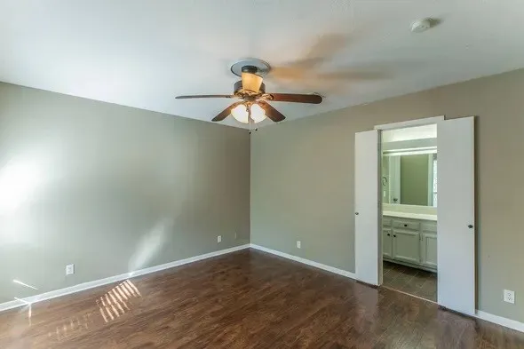 a view of room with window and ceiling fan