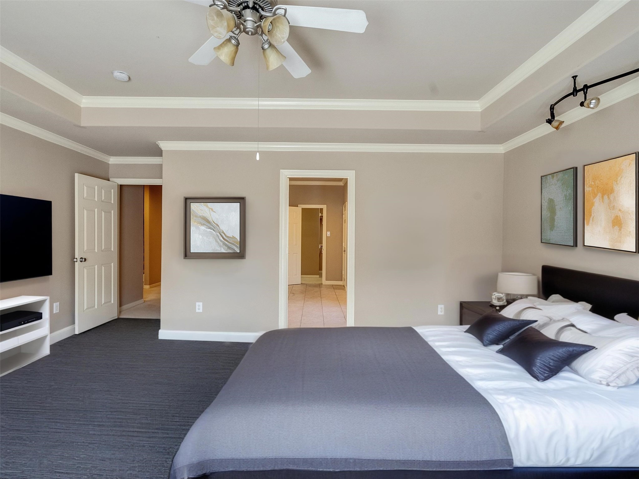 1502 Olive Place Houston, TX 77077 - Photo 17 of 27 Comfortable guest bedroom with bed set and nightstand included—neutral tones, ceiling fan, and private access to bath or closet.