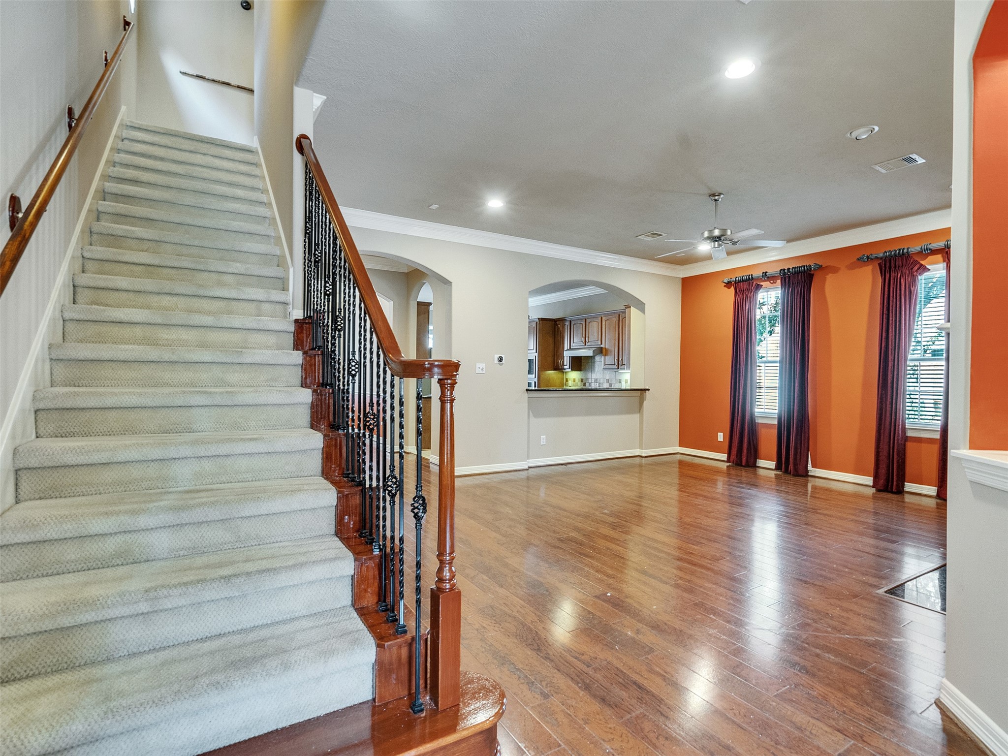 1502 Olive Place Houston, TX 77077 - Photo 6 of 27 Welcoming entryway with hardwood floors, elegant staircase and open access to living areas and kitche.