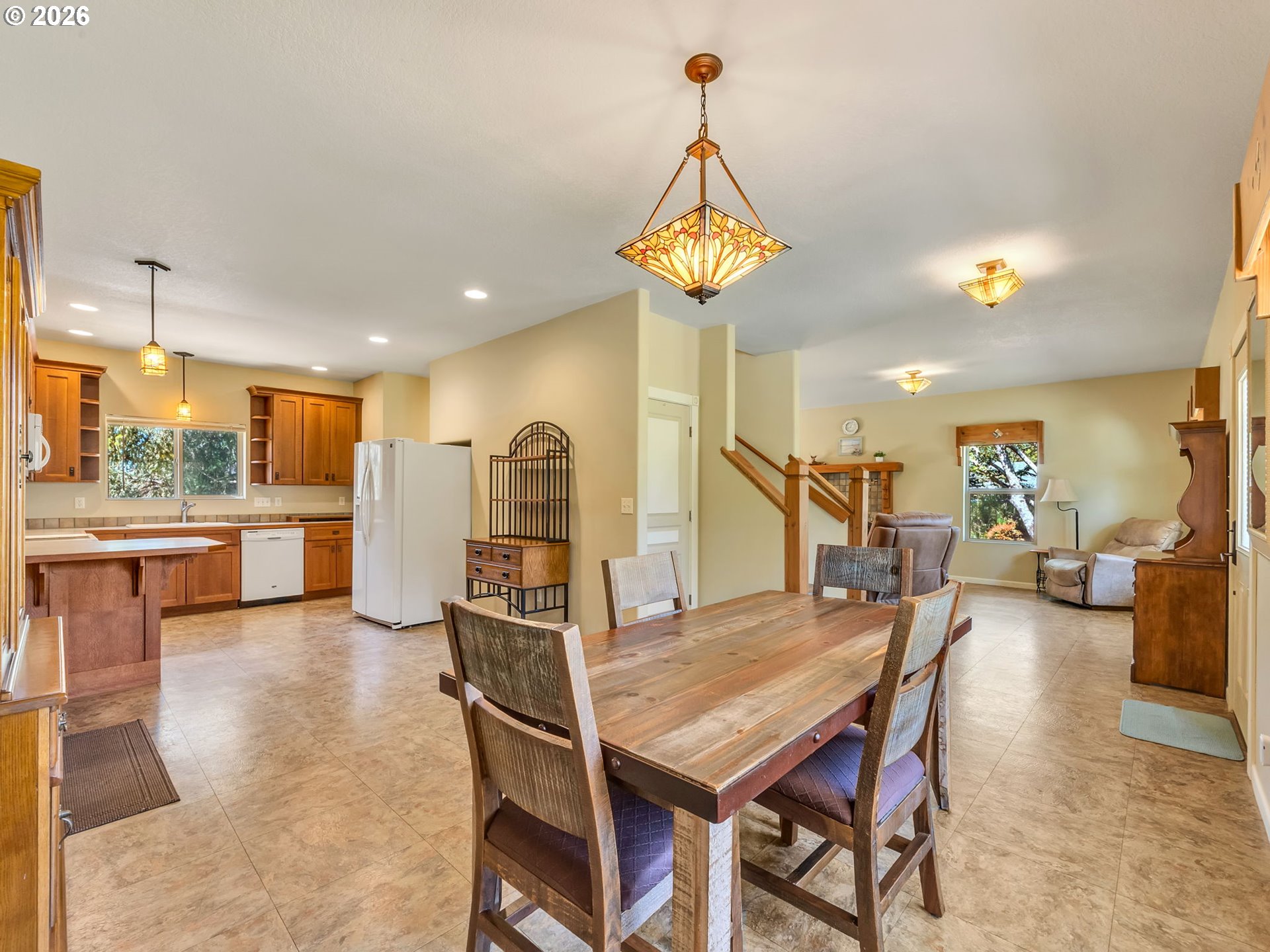1077 Southwest Ridge Road Warrenton, OR 97146 - Photo 27 of 46 a view of a dining room with furniture