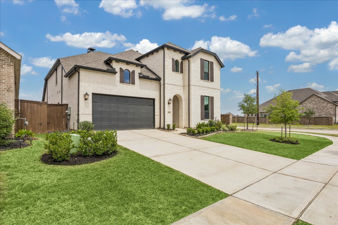 438 Livermore Street Webster, TX 77598 - Photo 1 of 34 a front view of a house with garden