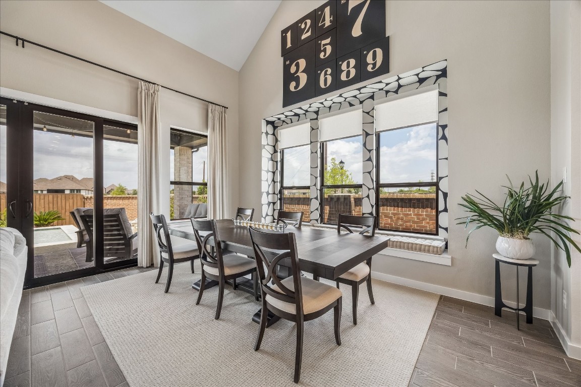 438 Livermore Street Webster, TX 77598 - Photo 14 of 34 a dining room with furniture and large windows