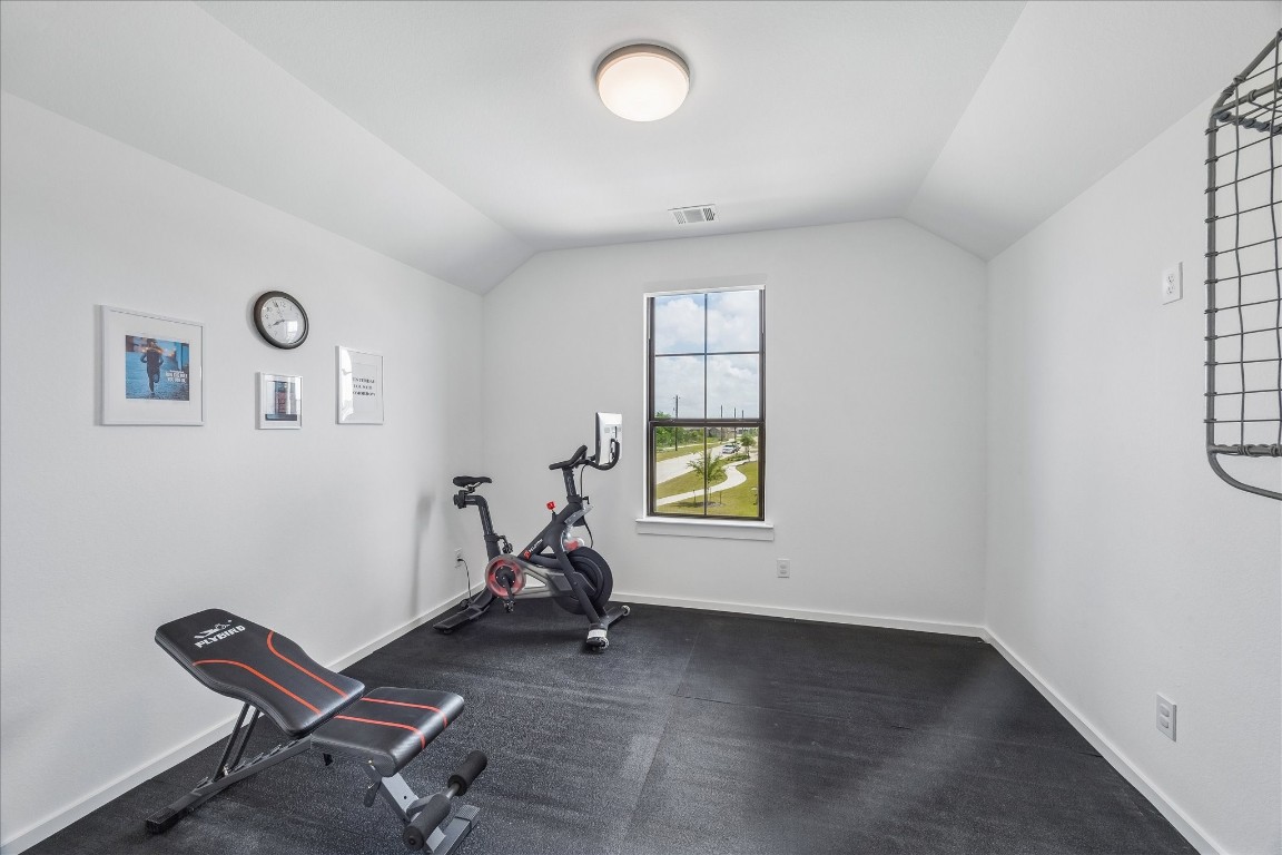 438 Livermore Street Webster, TX 77598 - Photo 26 of 34 a view of a room with gym equipment and a window