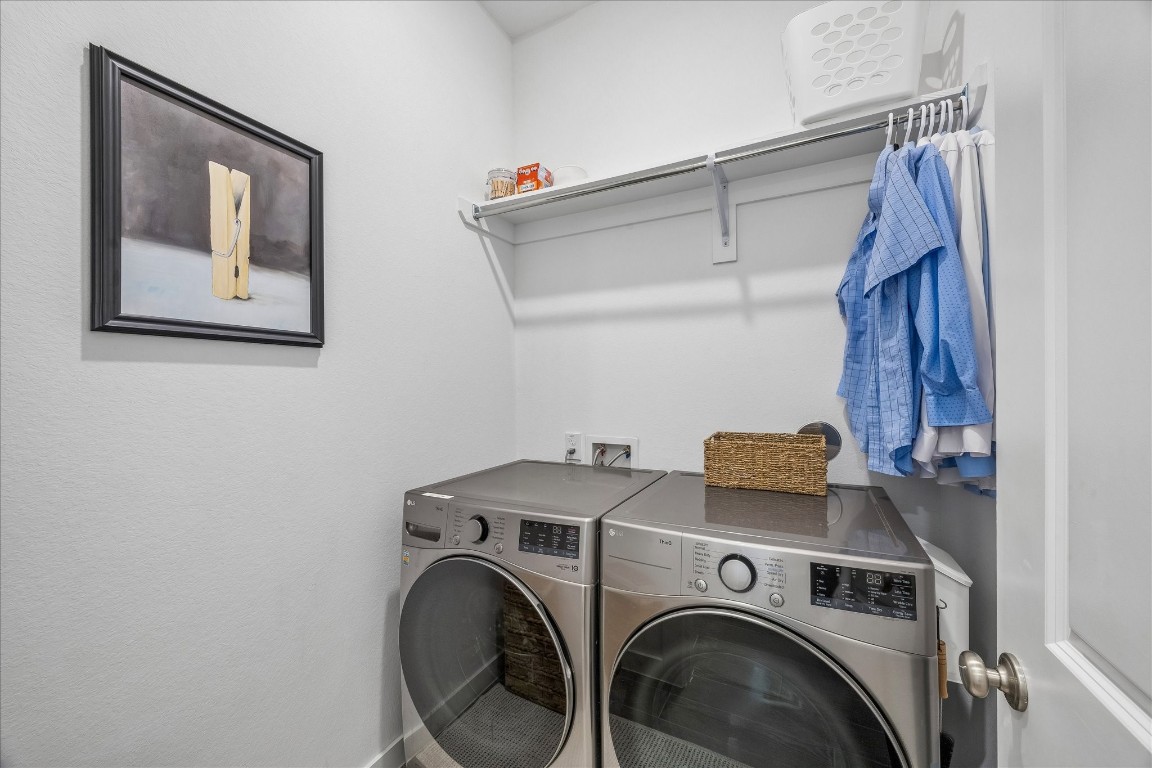 438 Livermore Street Webster, TX 77598 - Photo 28 of 34 a utility room with dryer and washer