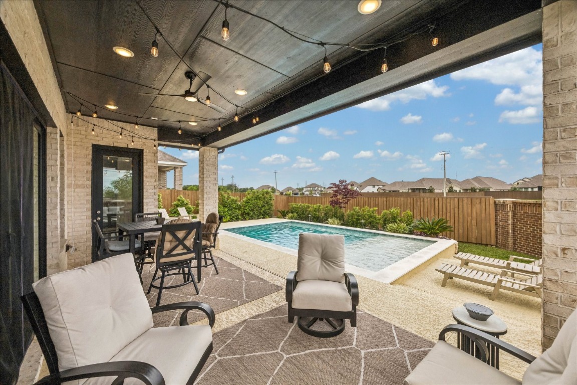 438 Livermore Street Webster, TX 77598 - Photo 29 of 34 a view of a terrace with furniture and outdoor view