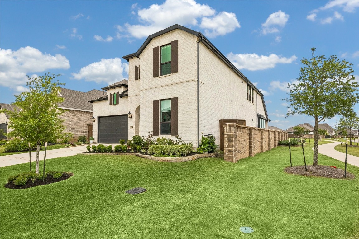 438 Livermore Street Webster, TX 77598 - Photo 3 of 34 a view of a house with a yard and plants