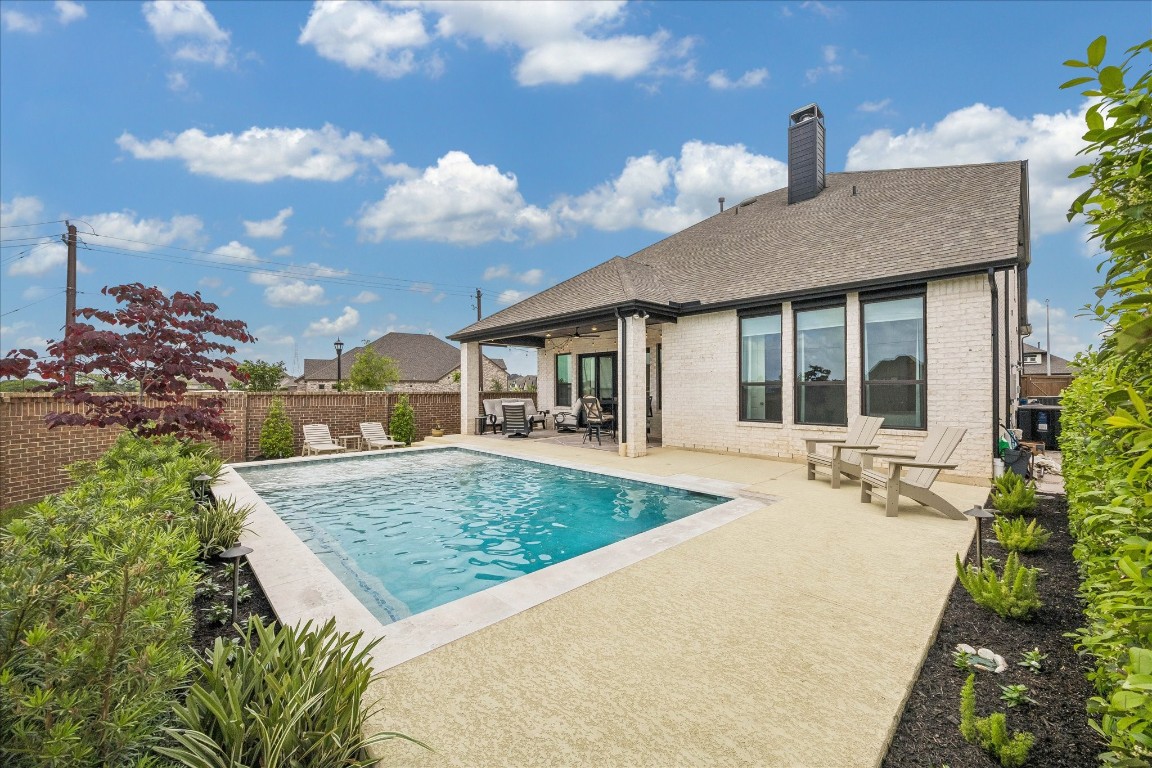438 Livermore Street Webster, TX 77598 - Photo 31 of 34 a front view of a house with garden