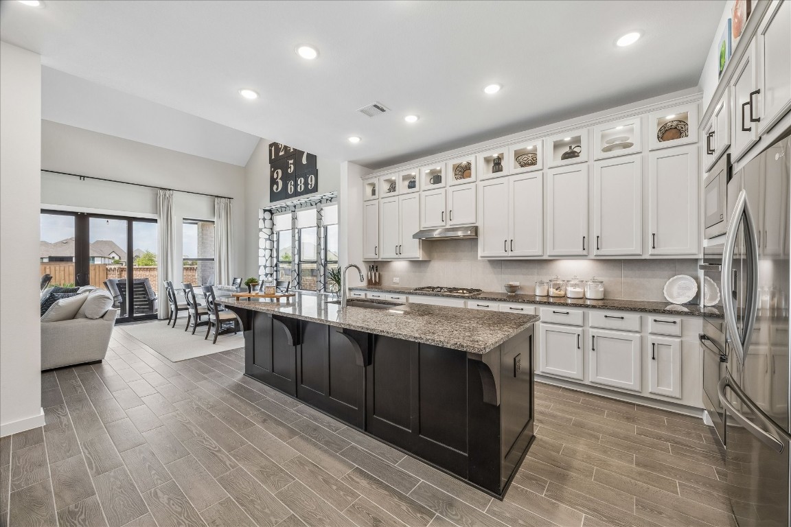 438 Livermore Street Webster, TX 77598 - Photo 6 of 34 a large kitchen with granite countertop lots of counter top space