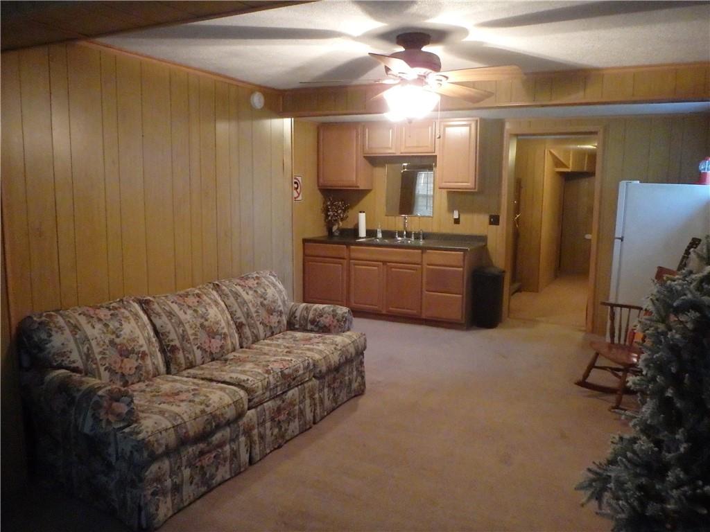 109 Youkers Road Butler, PA 16001 - Photo 20 of 30 a living room with furniture and a chandelier