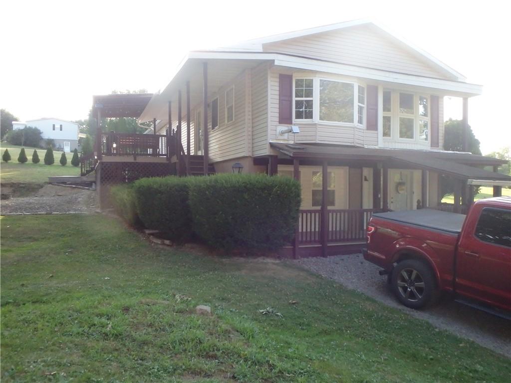 109 Youkers Road Butler, PA 16001 - Photo 27 of 30 a view of a house with a yard and sitting area