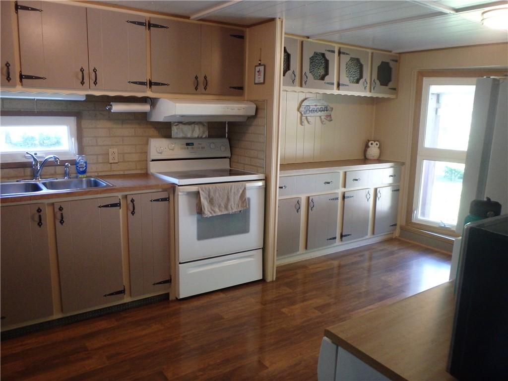 109 Youkers Road Butler, PA 16001 - Photo 5 of 30 a kitchen with stainless steel appliances granite countertop a stove a sink and a refrigerator
