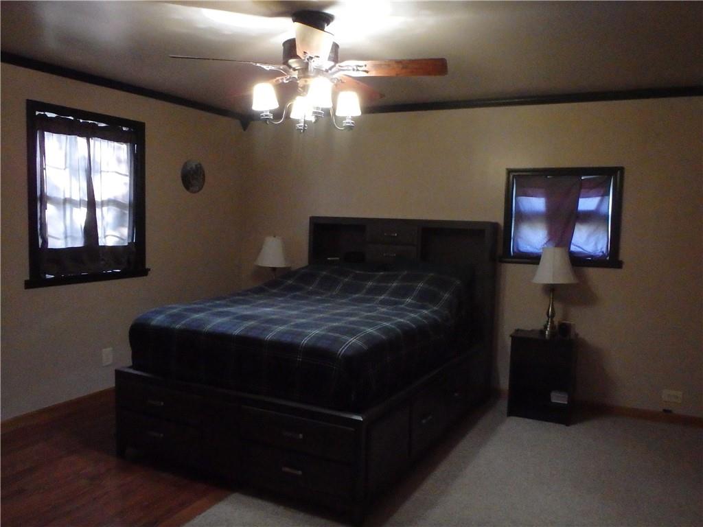 109 Youkers Road Butler, PA 16001 - Photo 10 of 30 a bedroom with a bed and a chandelier