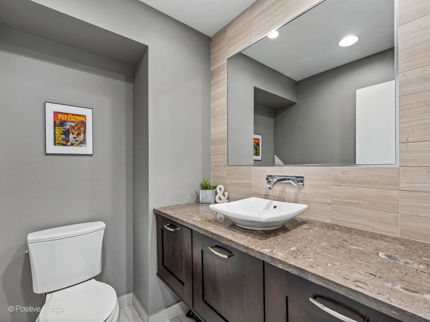 1720 North LaSalle Drive, Unit 1 Chicago, IL 60614 - Photo 12 of 28 a bathroom with a granite countertop toilet sink and mirror