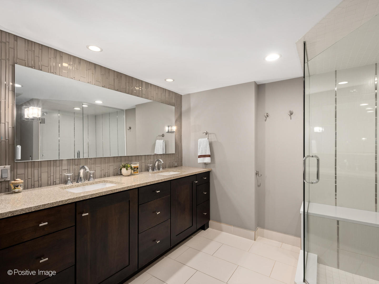 1720 North LaSalle Drive, Unit 1 Chicago, IL 60614 - Photo 14 of 28 a bathroom with a double vanity sink mirror and shower