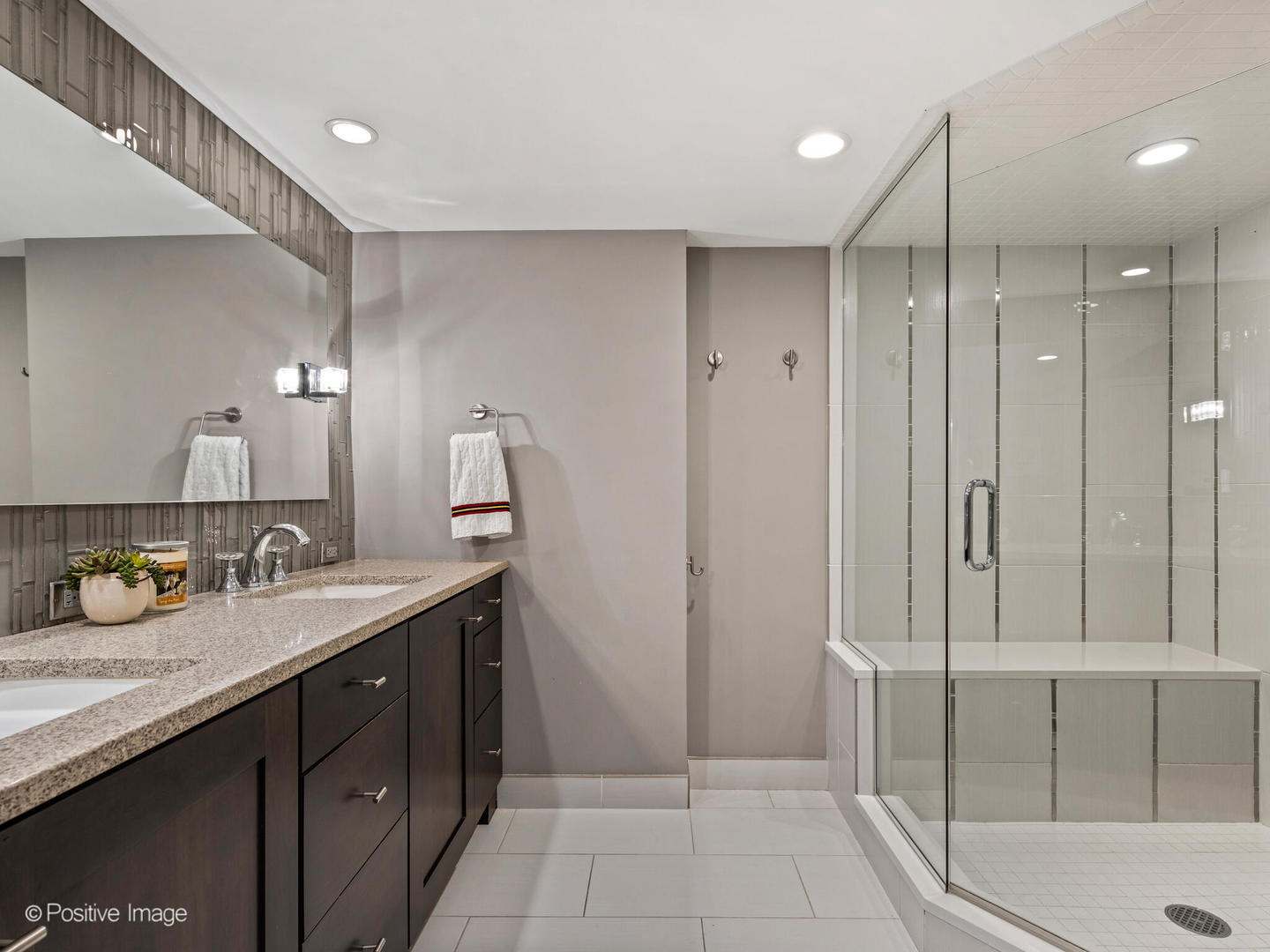 1720 North LaSalle Drive, Unit 1 Chicago, IL 60614 - Photo 15 of 28 a spacious bathroom with a double vanity sink a mirror and shower