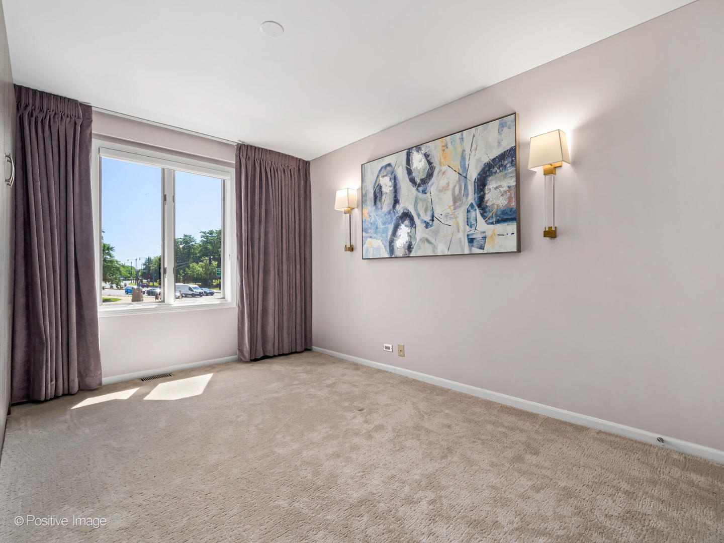 1720 North LaSalle Drive, Unit 1 Chicago, IL 60614 - Photo 18 of 28 a view of an empty room with a window and a painting on the wall
