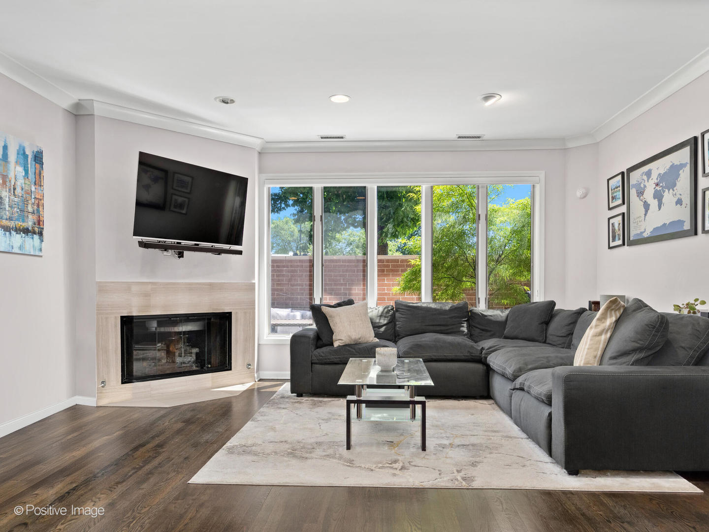 1720 North LaSalle Drive, Unit 1 Chicago, IL 60614 - Photo 3 of 28 a living room with furniture a flat screen tv and a fireplace
