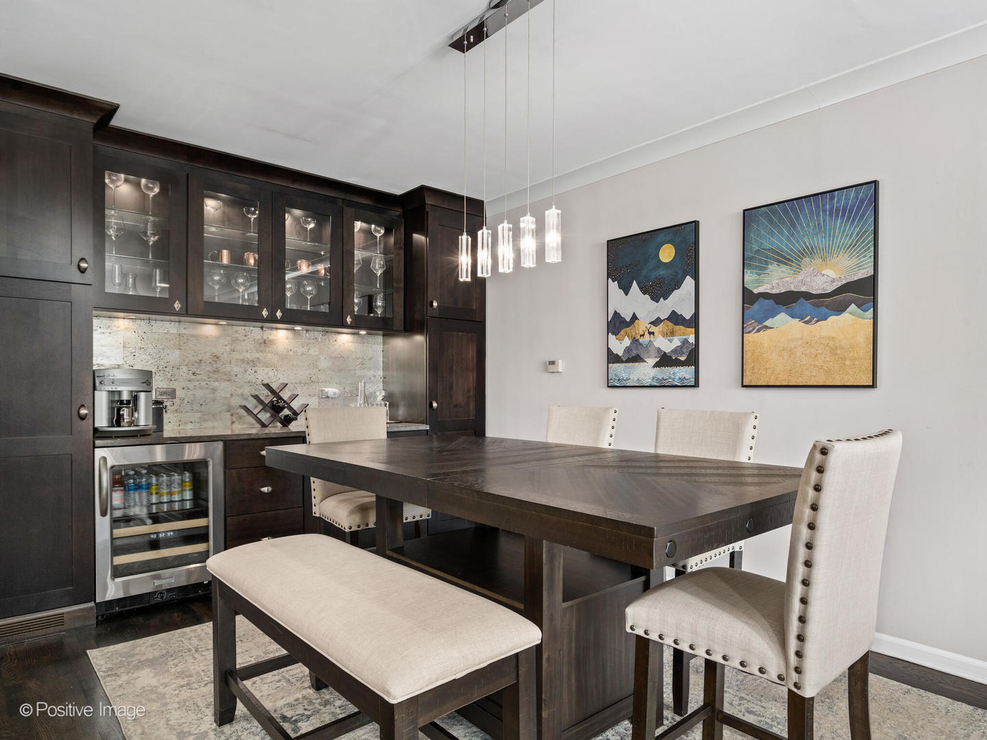 1720 North LaSalle Drive, Unit 1 Chicago, IL 60614 - Photo 7 of 28 a kitchen with a dining table chairs cabinets and stainless steel appliances