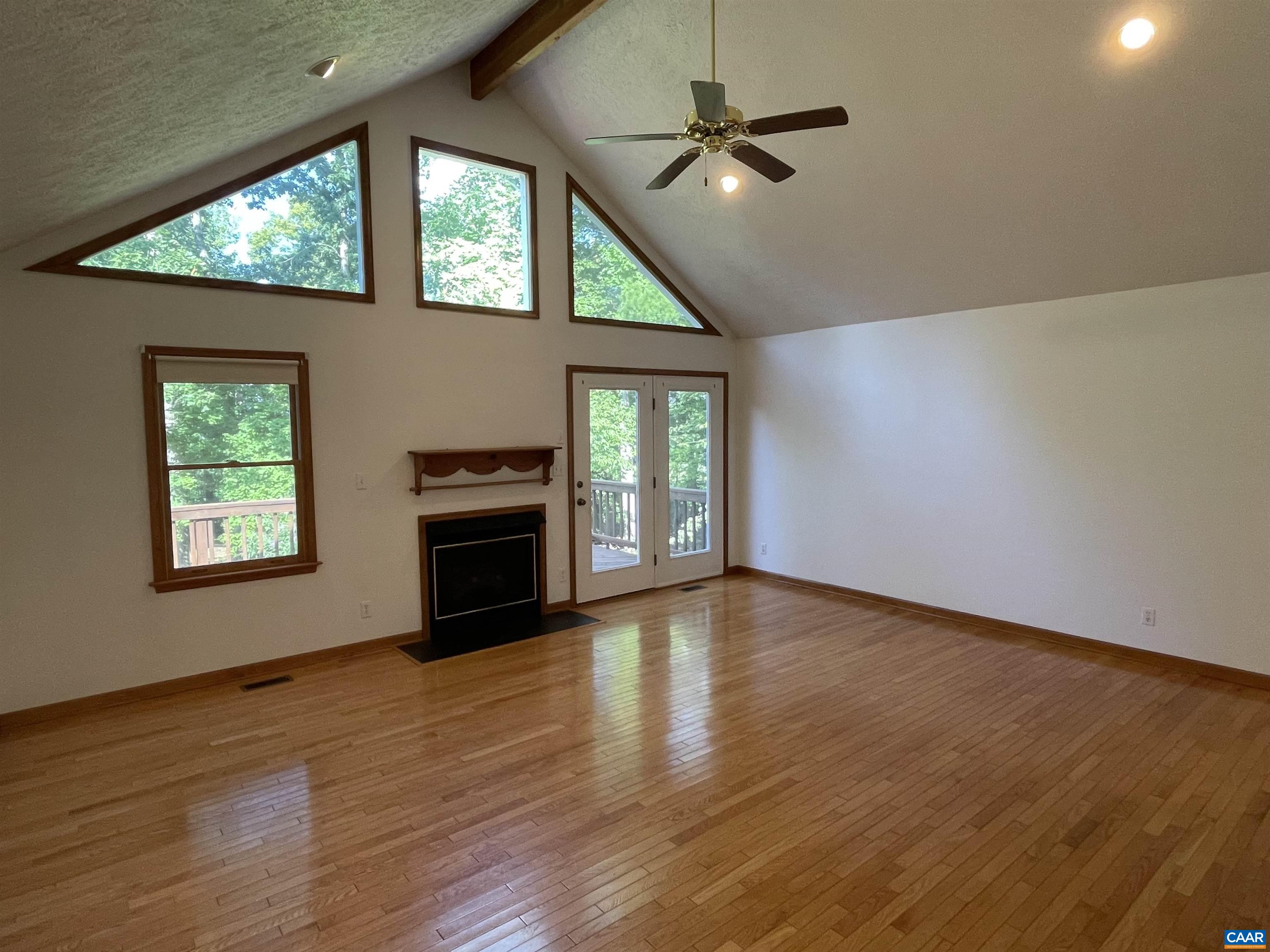 34 Fairview Lane Palmyra, VA 22963 - Photo 14 of 37 an empty room with windows fireplace and wooden floor