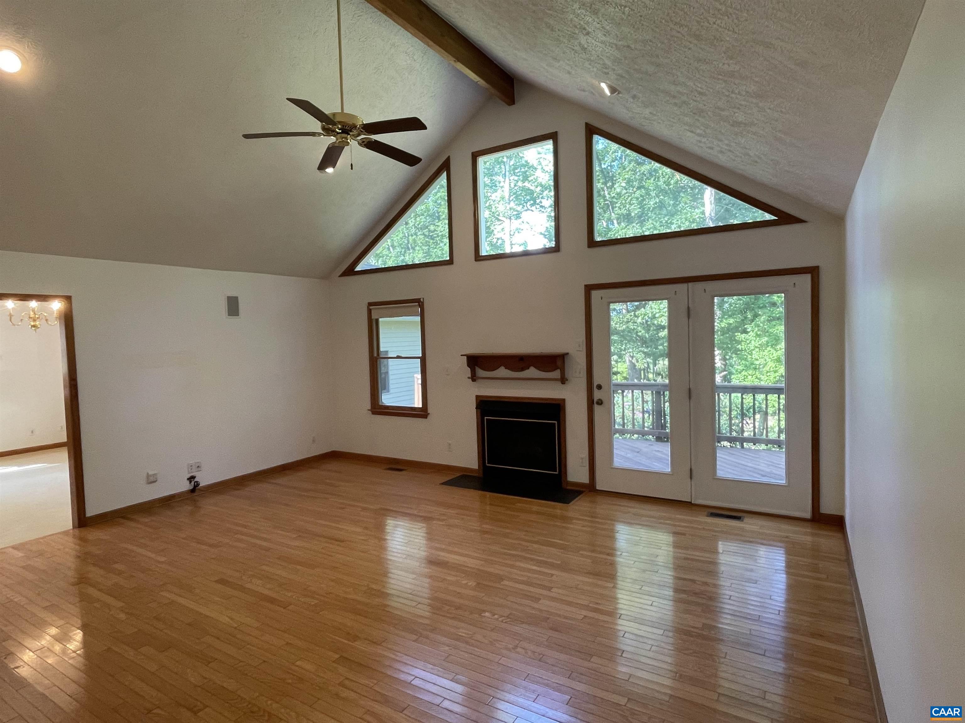 34 Fairview Lane Palmyra, VA 22963 - Photo 16 of 37 an empty room with windows fireplace and wooden floor