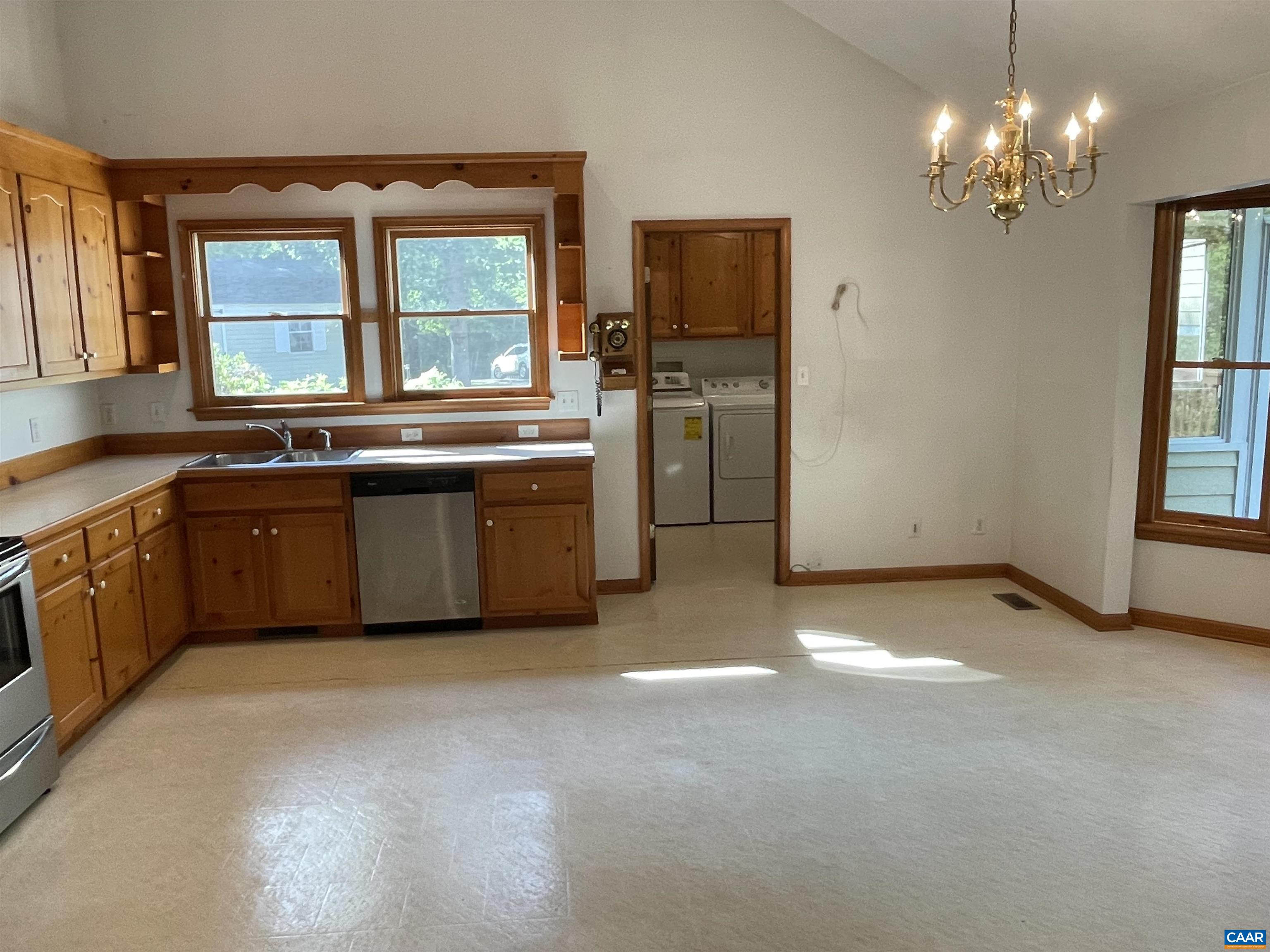 34 Fairview Lane Palmyra, VA 22963 - Photo 21 of 37 a view of a kitchen with stainless steel appliances granite countertop a stove top oven a sink dishwasher and a fireplace with wooden floor