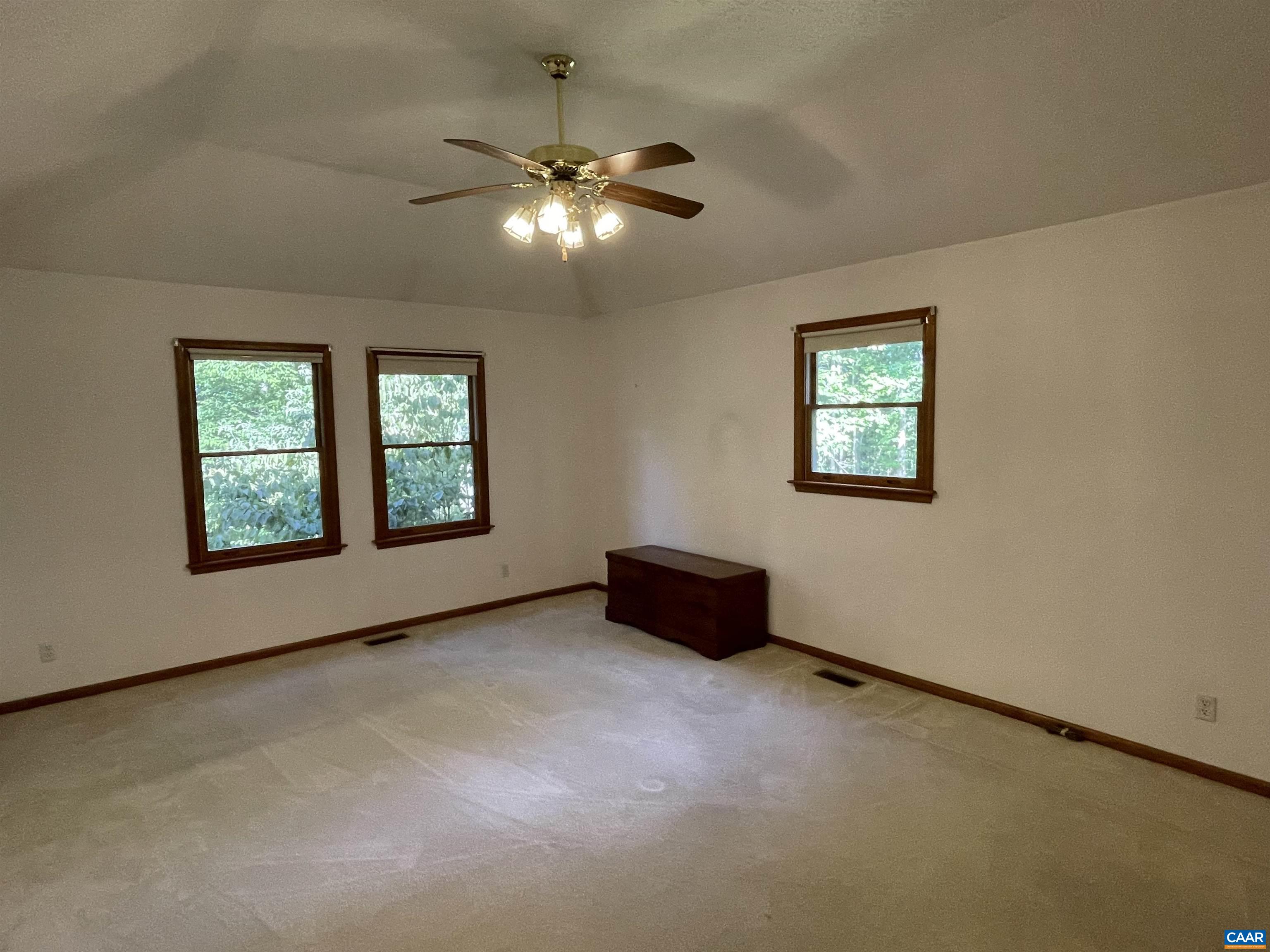 34 Fairview Lane Palmyra, VA 22963 - Photo 23 of 37 an empty room with windows and chandelier fan