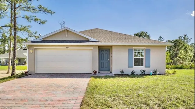 a front view of a house with yard