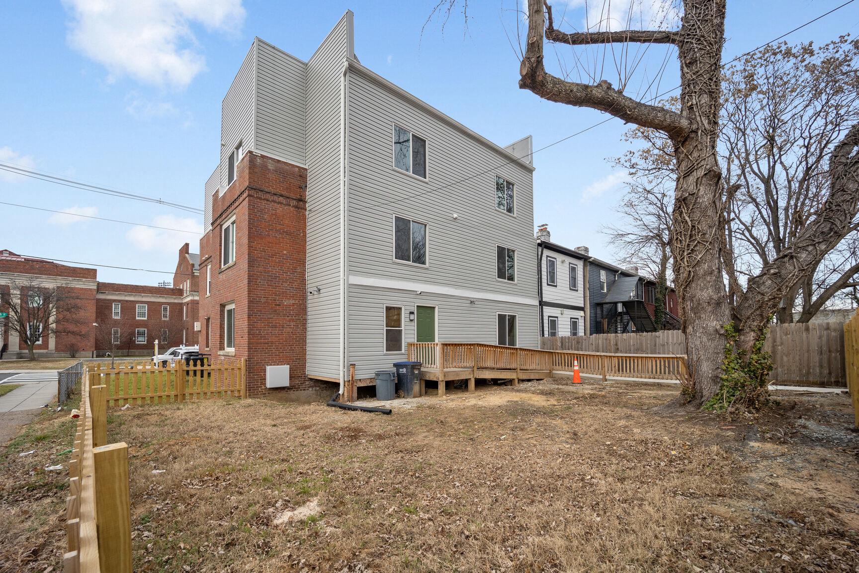1642 16th Street Southeast, Unit 3 Washington, DC 20020 - Photo 3 of 22 a front view of a house with a yard
