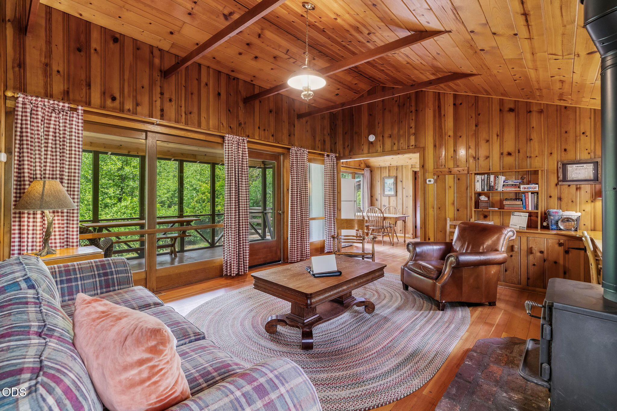 13375 Southwest Forest Service Road, Unit 3 U1 Camp Sherman, OR 97730 - Photo 8 of 29 a living room with furniture a wooden floor and a large window