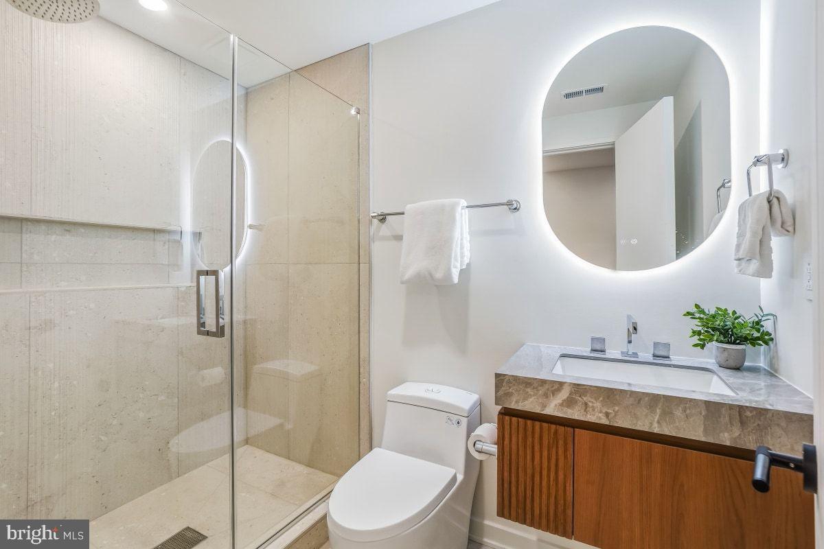 3554 T Street Northwest Washington, DC 20007 - Photo 49 of 57 a bathroom with a sink toilet and shower