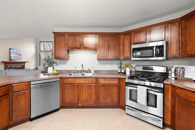a bedroom with a bed table closet and a window