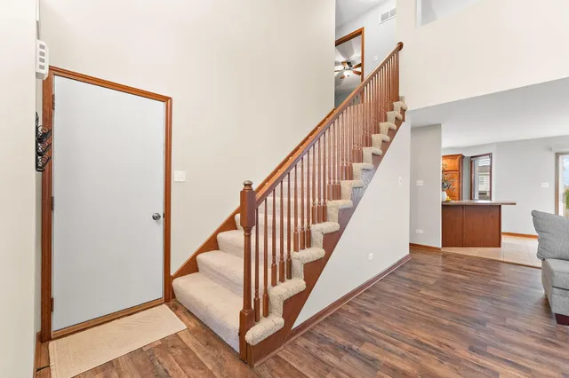a view of an entryway with wooden floor