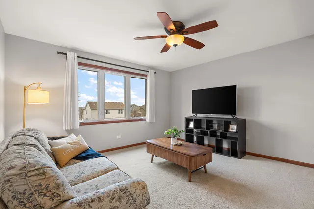 a living room with furniture and a rug