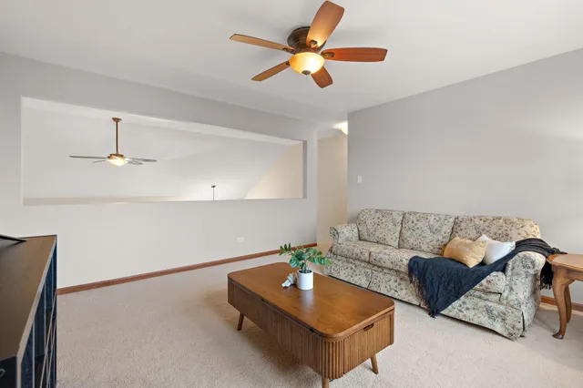 a work room with furniture and a flat screen tv