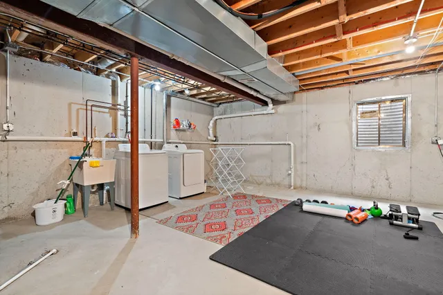 a view of a patio with table and chairs
