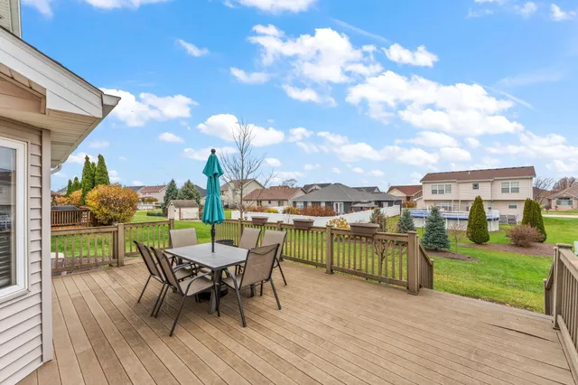 a view of a house with patio and a yard