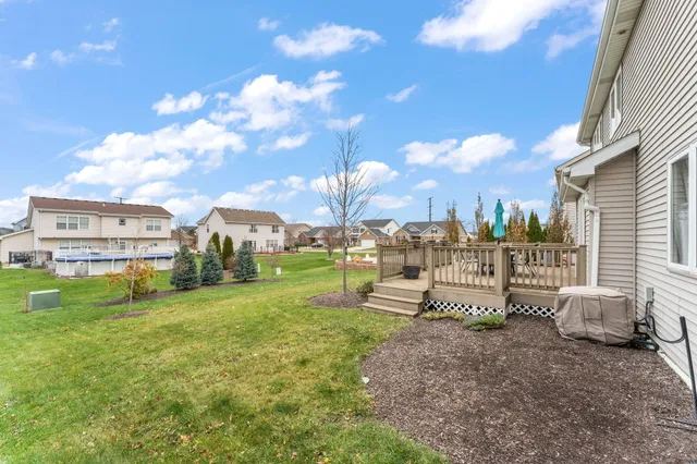 a view of a house with yard and tree s