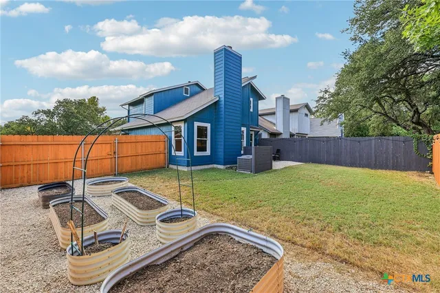 a view of a backyard with a tub