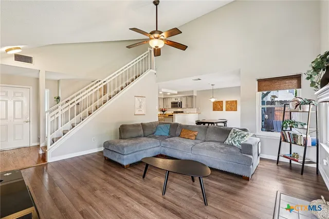 a living room with furniture and a table