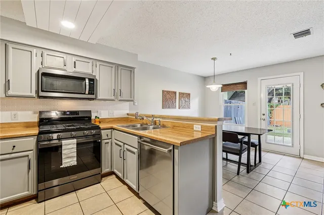 a kitchen with a stove and a microwave