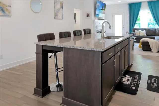 a kitchen with a sink a stove and a refrigerator