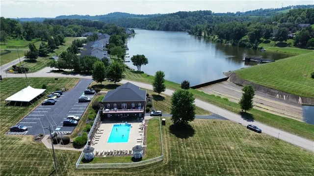 an aerial view of a house with a lake view