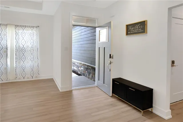 a view of room with window and hardwood floor