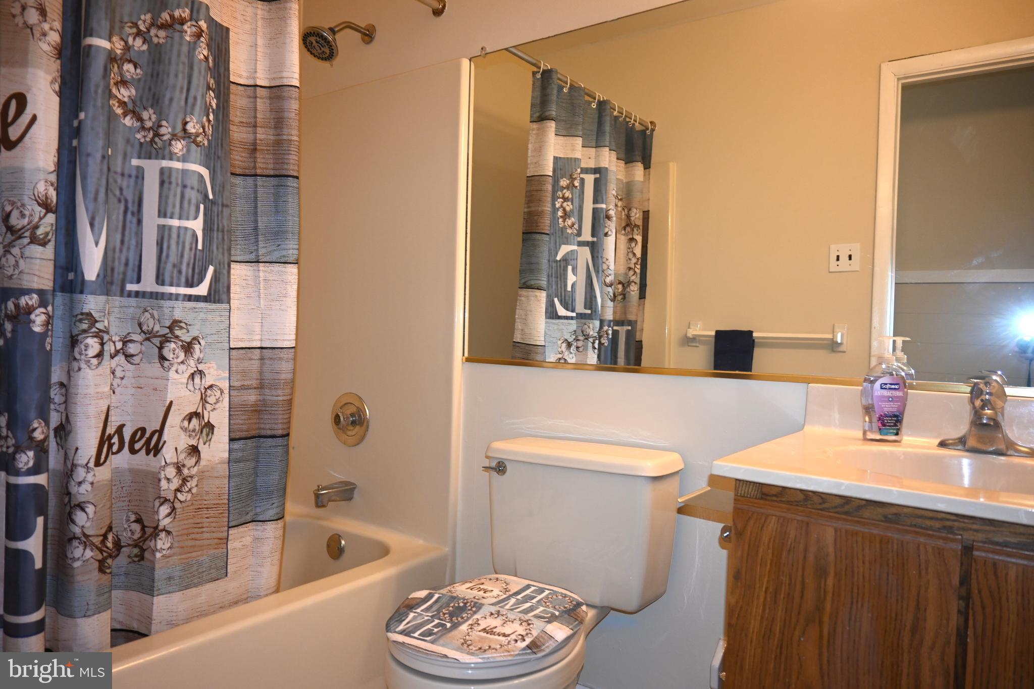 613 St Anthony Lane Upper Darby, PA 19082 - Photo 24 of 30 a bathroom with a sink a toilet and shower
