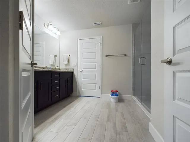 a room with a cabinets and a dresser