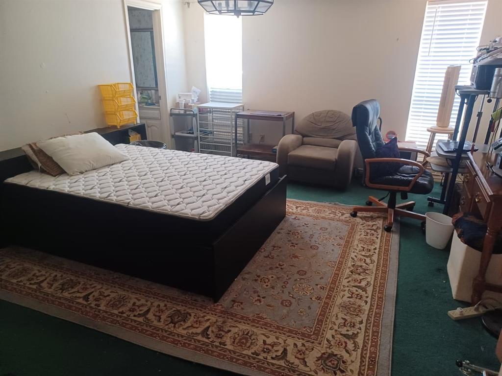 13114 Halwin Circle Dallas, TX 75243 - Photo 14 of 23 a living room with furniture and a rug